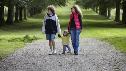 Visitors walking in the grounds at Springhill, County Londonderry, Northern Ireland.